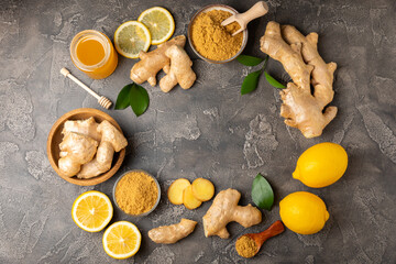 Fresh ginger on wooden background. Dry ginger. Sliced ​​ginger with honey and lemon. Ginger...