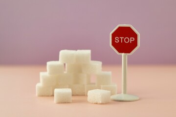 Diabetes; No more sugar; Stop using so much sugar; Too much sugar; Sugar cubes with a stop sign