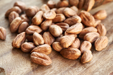 Shelled hazelnuts spilled on a table