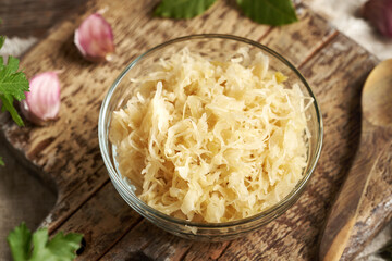 Fermented cabbage or sauerkraut in a glass bowl