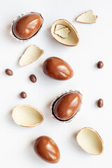 Cracked and whole chocolate eggs, top view