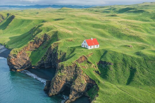 Remote Coastal Seaside House and Cliffs under Blue Sky