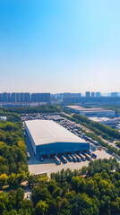 Aerial view of the warehouse building with a blue color and white metal roof
