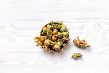 Fresh filbert nuts or hazelnuts with leafy shells, top view