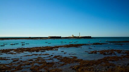 Scenic view of sea with clear blue sky