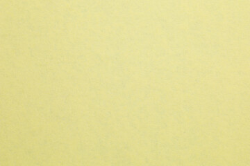 Fototapeta premium A yellow background with a white spot, textured origami paper backdrop