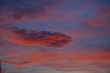 Whispers of twilight - Soft oranges and gentle purples blend in a serene sunset sky, a tranquil cloudscape evoking peace and calm