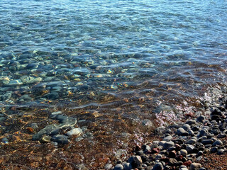 Sea waves on pebbly beach