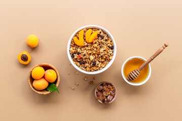 Top view of breakfast with oatmeal granola and ingredients. Healthy morning routine