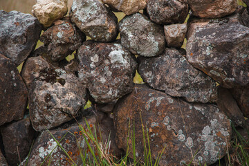 Stacked rock structure with moss and natural lichens