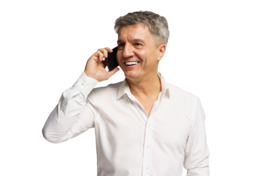 Man smiling while talking on mobile phone in a bright, casual setting during the day