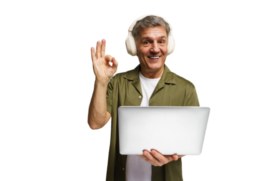 Man with headphones smiles and gives an okay hand gesture while holding a laptop at home - Powered by Adobe