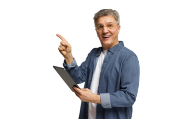 Senior man smiling and pointing while holding a tablet against a plain background