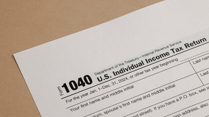 Tax Form 1040: Preparing for Individual Income Tax Filing. Essential paperwork for tax season, reflecting financial responsibility and compliance.