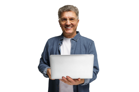 Smiling man holding a laptop while expressing joy in a bright setting