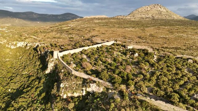 Aerial shot of entire Kelefa Castle near Oitylo sea bay at sunset, Mani, Laconia, Greece.