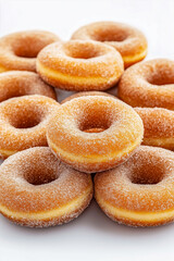 A stack of donuts with powdered sugar on top