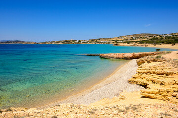 Fototapeta premium Koufonisia Fanos beach with clear water and rock formations. The south of Koufonisi. Small Cyclades, Greece