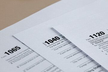 Tax Forms: Individual, Partnership, and Corporate. Preparing for the tax season with various official forms to file with the tax revenue service.