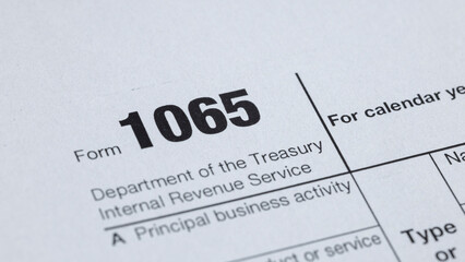 Close-up of a Form 1065 tax document, used for reporting partnership income to the Treasury. Filing...