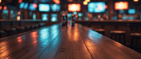 Empty wooden bar top and counter in a sports bar or pub with blurred background and no customers present