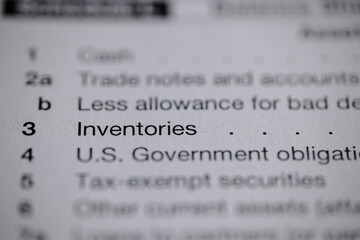 Close-up on financial document showing line items: trade notes, allowance for bad debt,...