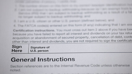 Close-up of a form requiring a signature, indicating important instructions and certifications for...