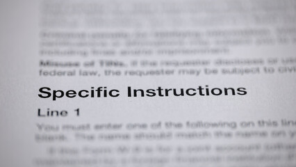 A close-up shot of a printed document, with the heading 