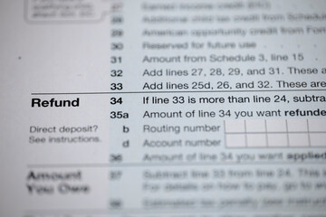 Tax form section showing refund options and direct deposit details, focusing on financial paperwork and fiscal responsibility during tax season.