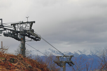 Cable car poles in mountains in late autumn. Rosa Khutor Resort, Sochi, Russia