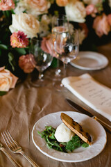 Exquisite dining experience with elegant floral decor and gourmet dish at a lavish event