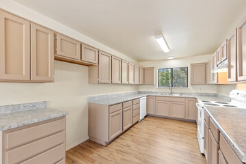 a home kitchen with countertop and cabinets