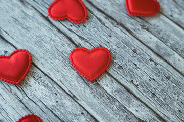 Red hearths on  wooden background. Valentines Day banner. 