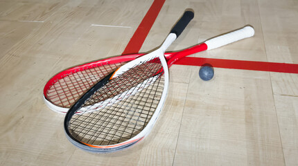 Sports, above and racket on squash court for competition, challenge and training center. Exercise, interior and empty room with top view of wooden floor of gymnasium for games, fitness club and gear