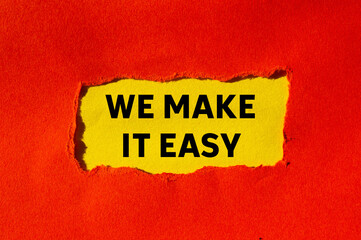 We make it easy message written on ripped torn red paper on yellow background. Conceptual we make it easy symbol. Copy space.