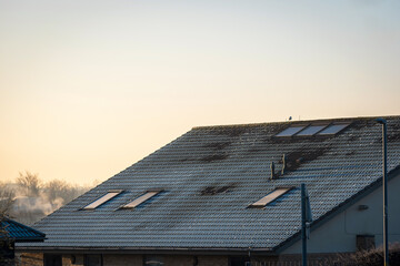 Frost snow covered british house roof in england uk