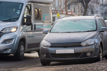 Frost snow covered british road and cars in england uk