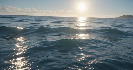 Fototapeta premium Soft blue hues of sunlight dance across the surface of the ocean , sun, wave