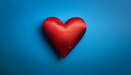 red heart on blue wooden background