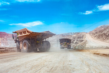 Dump trucks at an open-pit copper mine.
