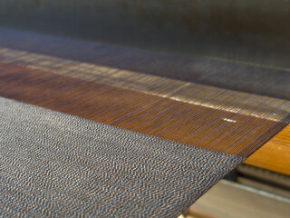 Weaving, traditional crafts,Close-up of a loom weaving, Woven silk,using cotton and silk string...