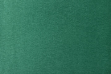 Texture of genuine leather, artificial leatherette green background