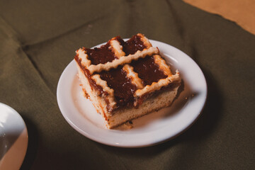 Piece of pastafrola served on a small plate in a restaurant.