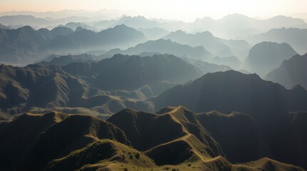 Misty fog blankets the scenic mountain landscape at dawn, creating a beautiful, ethereal view