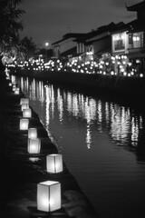 Scenic waterway with illuminated pathway at night.