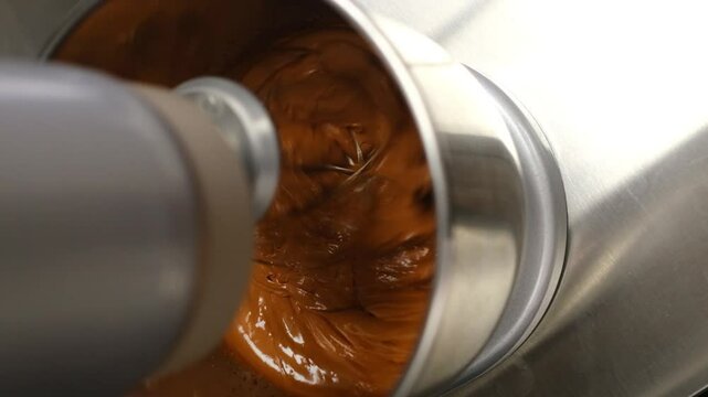Close-up of whipping cream in a professional food processor. Making dough for macarons