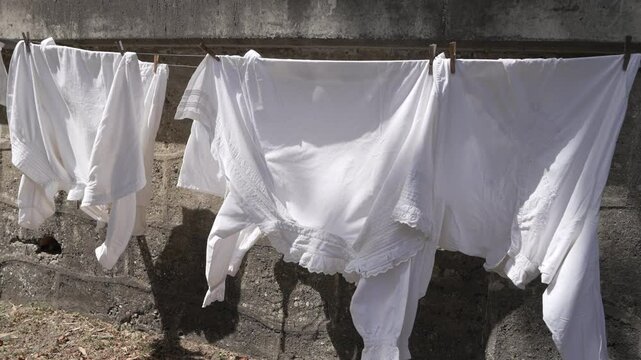 medieval laundry drying on clothesline in the wind