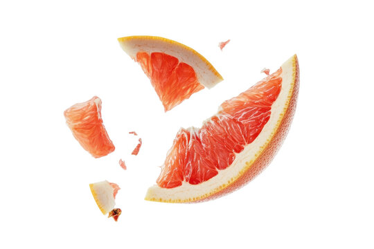 Vibrant grapefruit segments float gracefully mid-air, shattering into fragments isolated on transparent background