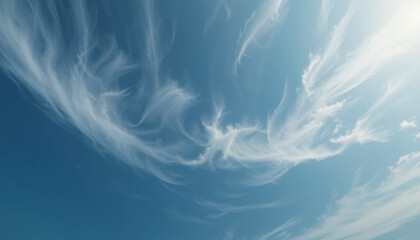 Dramatic swirling clouds in a dark blue sky for backgrounds