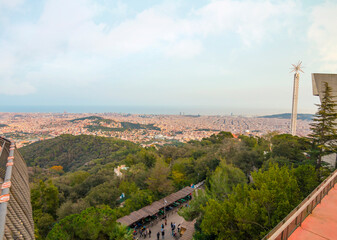 Obraz premium Tibidabo in Barcelona features breathtaking city views, the iconic Sagrat Cor church, and a historic amusement park, offering a perfect mix of culture and adventure